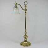 An early 20th century Arts and Crafts brass table lamp