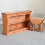 A modern pine dwarf open bookcase