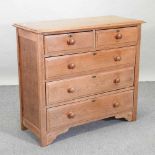 A modern light oak chest of drawers