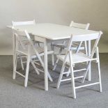 A modern white painted dining table