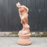 A large terracotta garden statue