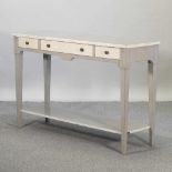 A reproduction French style grey and cream painted side table