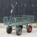 A green painted metal garden trolley