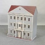 A painted wooden doll's house