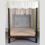 An early 20th century four poster bed