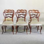 A set of six Victorian carved rosewood dining chairs