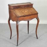 A late 19th century French style marquetry bureau de dame