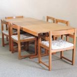 A 1970's teak extending dining table