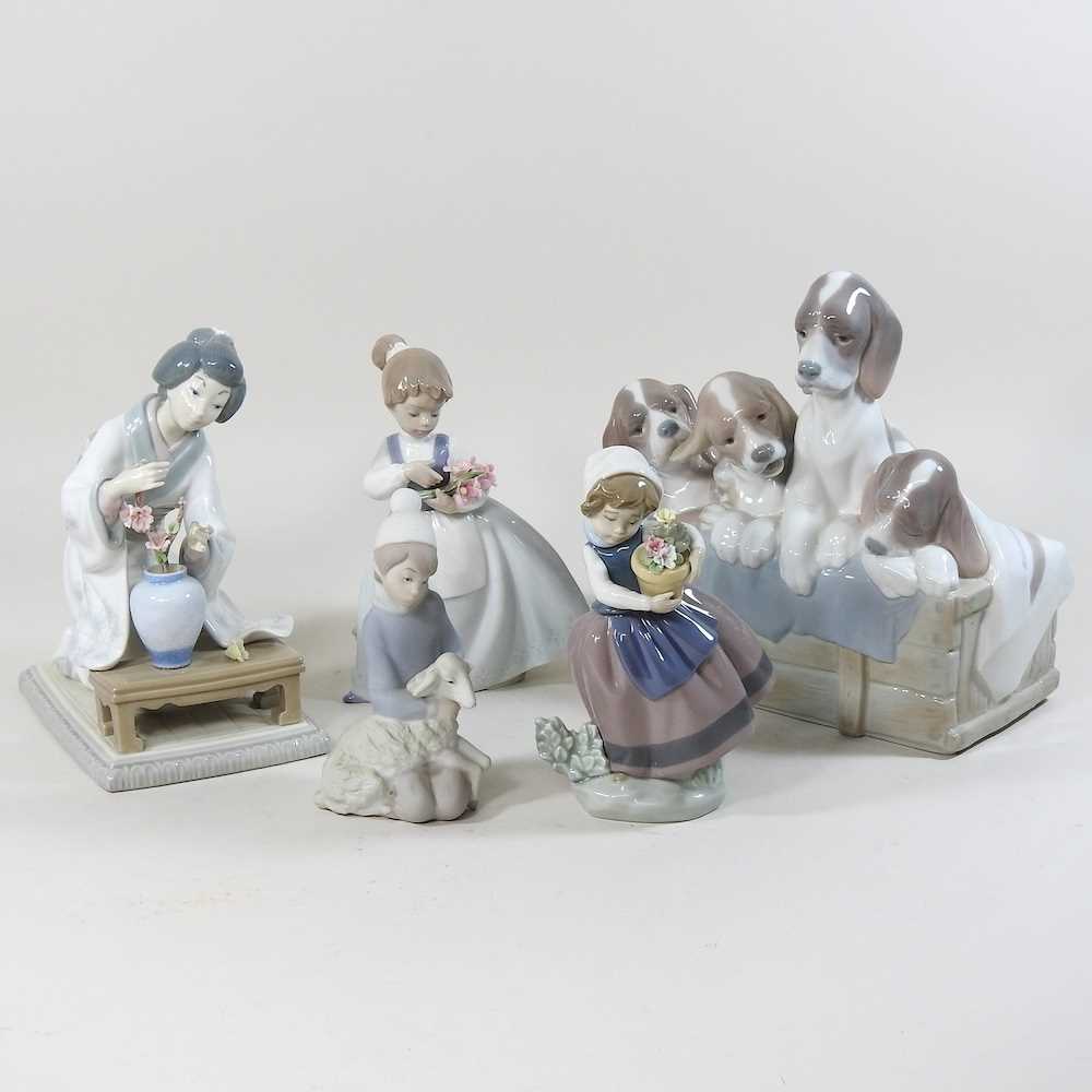 A collection of Lladro and Nao figures
