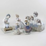 A collection of Lladro and Nao figures