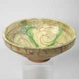 A Persian glazed pottery bowl
