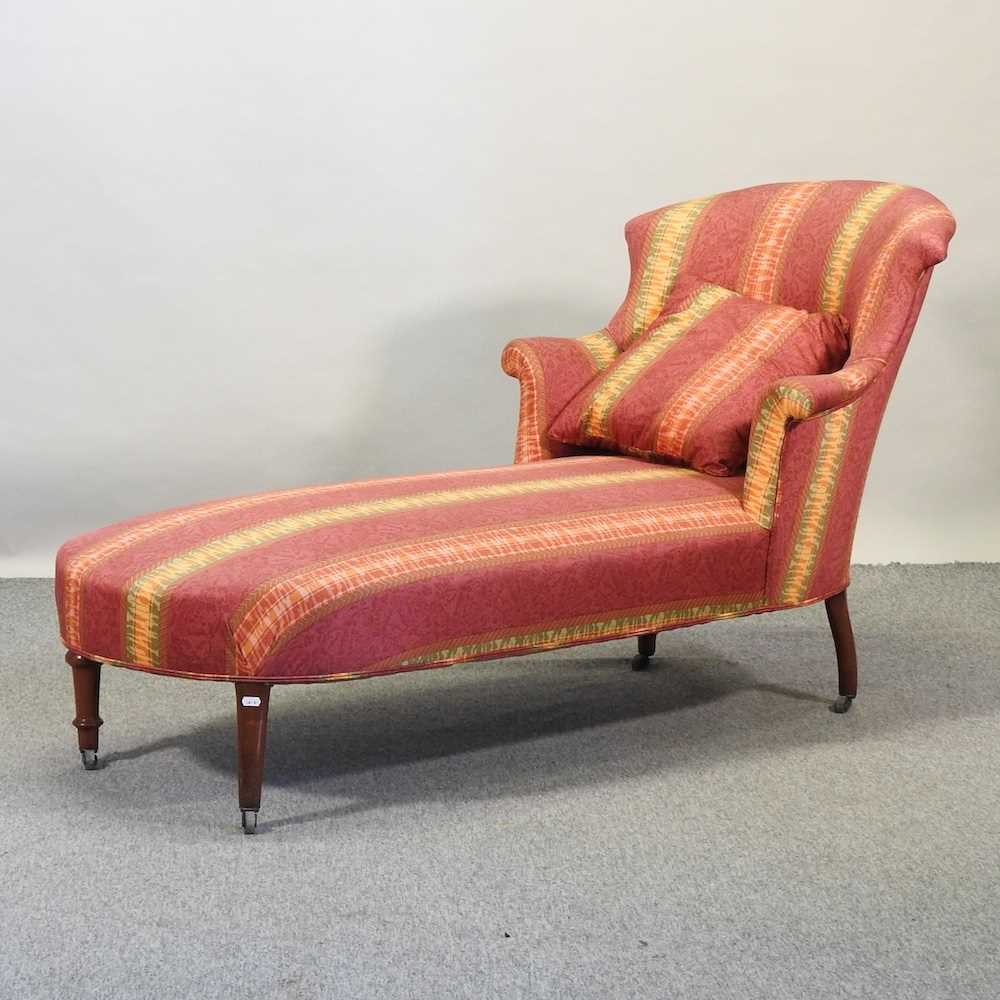 A 19th century French red upholstered chaise longue