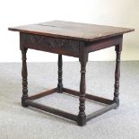 An 18th century carved oak side table