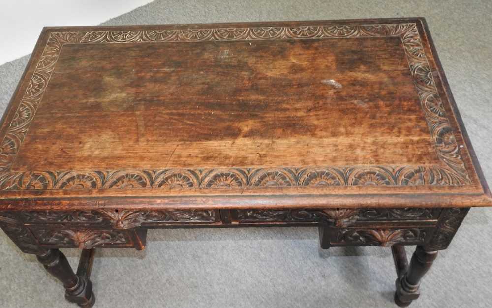 A 19th century carved oak kneehole desk - Image 5 of 8