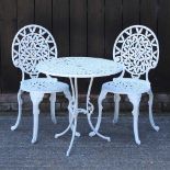 A white painted metal patio set