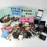 A collection of costume jewellery and coins
