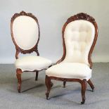 A near pair of Victorian cream upholstered nursing chairs