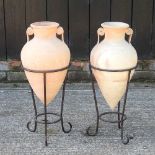 A pair of terracotta amphora vases