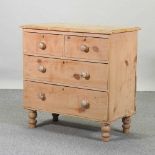 An antique pine chest of drawers