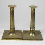 A pair of George III brass table socket candlesticks