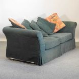 A modern green upholstered sofa