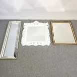 A gilt framed wall mirror