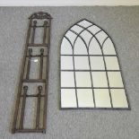 A metal wall hanging boot rack,