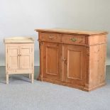 An antique pine side cabinet
