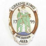 An early 20th century Doulton Lambeth stoneware Greene King wall plaque