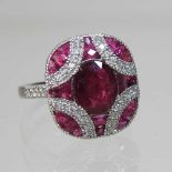 A platinum. ruby and diamond cluster ring