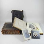 A Victorian music box in the form of a photograph album
