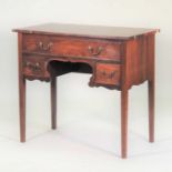 A 19th century mahogany and crossbanded lowboy