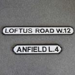 A modern wooden road sign of Anfield