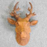 A rusted metal model of a deer head