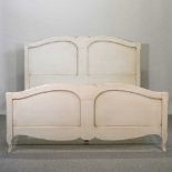 A modern French style cream painted double bed