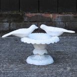 A painted cast iron bird bath