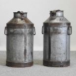 A decorative metal milk churn, together with another