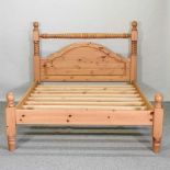 A modern pine double bedstead