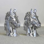 A pair of large polished aluminium horse head finials