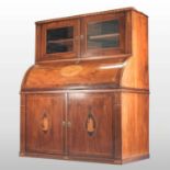 An unusually large 19th century mahogany and inlaid cylinder desk