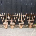 A set of four fan shaped garden trellis