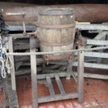 A 19th century wooden end over end barrel butter churn