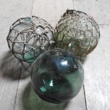 Two green glass fishing floats