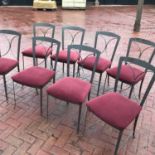 A set of eight metal framed dining chairs