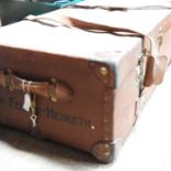 A large early 20th century leather bound trunk