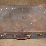 A small brown leather suitcase