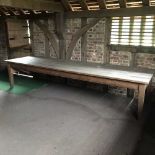 A large rustic pine kitchen table