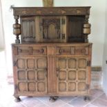 An early 20th century carved oak court cupboard