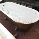 A cast iron roll top bath