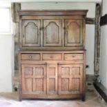 An 18th century elm livery cupboard